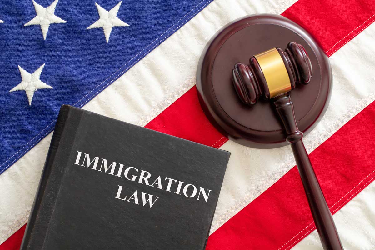 immigration-law-book-with-flag-and-gavel-2026-03-16-01-17-31-utc Immigration Law Book With Flag And Gavel