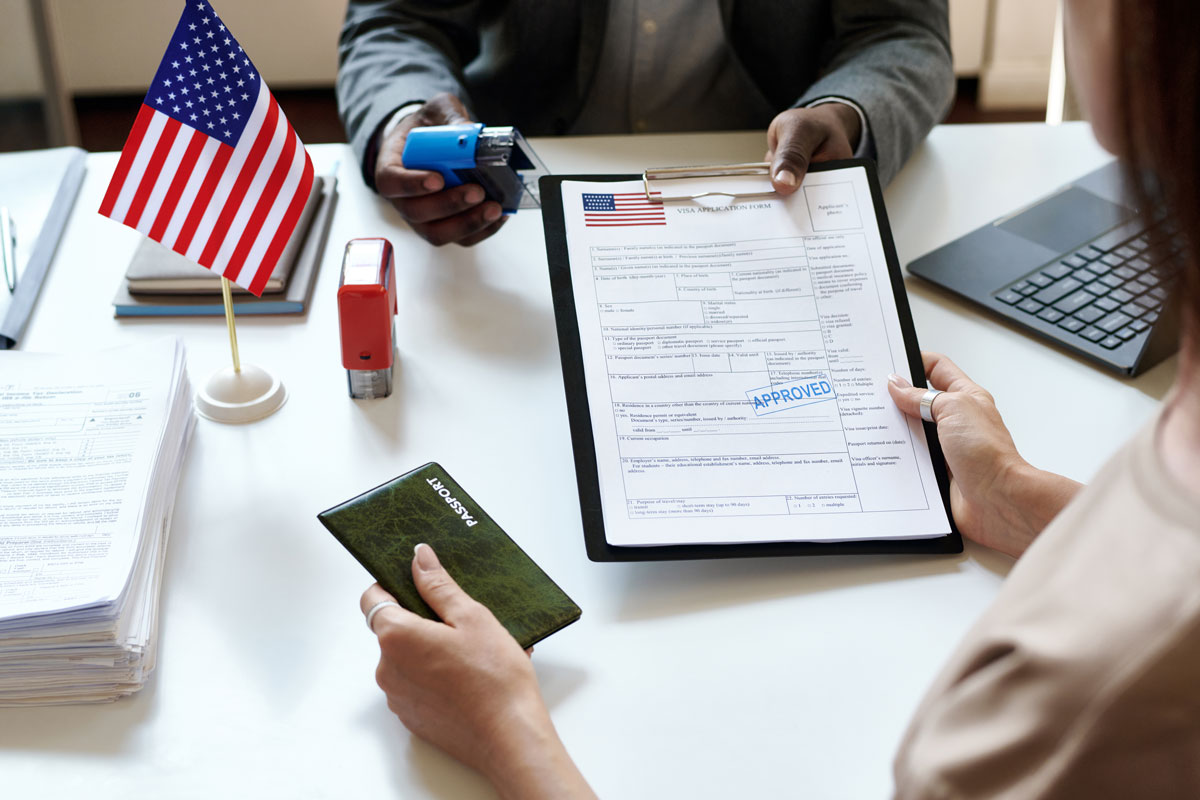 visa-application-approved-with-passport-and-us-flag Visa Application Approved With Passport And Us Fla